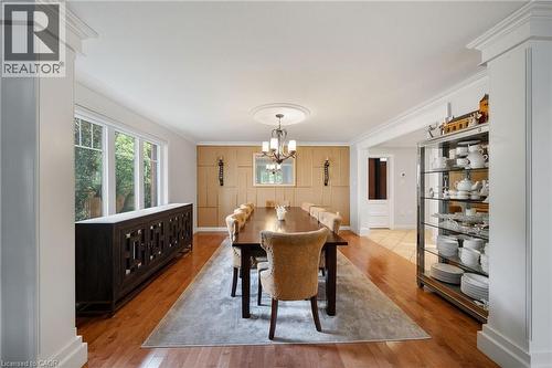 Formal dining room featuring wood-finish flooring, a decorative ceiling medallion, and a chandelier lighting fixture - 39 Elodia Court, Hamilton, ON 