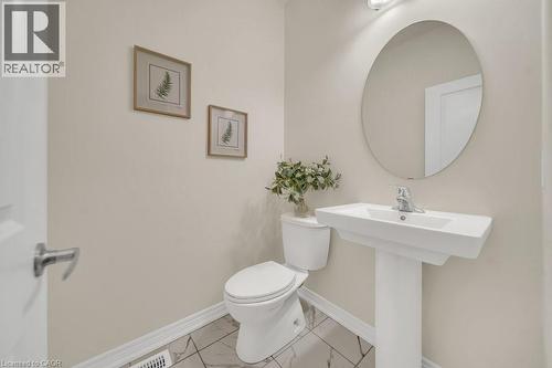 Bathroom featuring toilet and marble finish floors - 285 Broadacre Drive, Kitchener, ON 