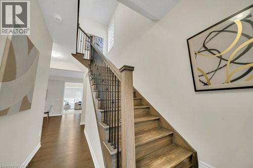 Staircase with healthy amount of natural light, wood finished floors, and a towering ceiling - 285 Broadacre Drive, Kitchener, ON 