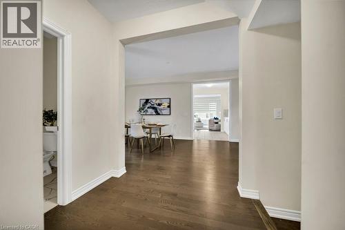 Hall featuring dark wood-type flooring and baseboards - 285 Broadacre Drive, Kitchener, ON 