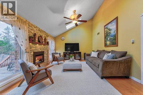 soaring ceilings/ skylights and gas fireplace/lots of natural light - 247 Rolling Acres Court, Kitchener, ON - Indoor Photo Showing Living Room With Fireplace