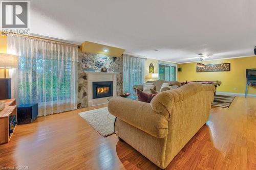 basement with gas fireplace and walk-out to yard - 247 Rolling Acres Court, Kitchener, ON - Indoor Photo Showing Living Room With Fireplace