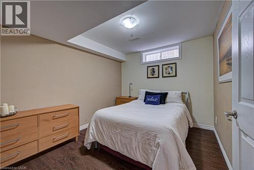 Bedroom featuring wood-finish flooring and a light-colored wall palette - 37 Davinci Boulevard, Hamilton, ON 