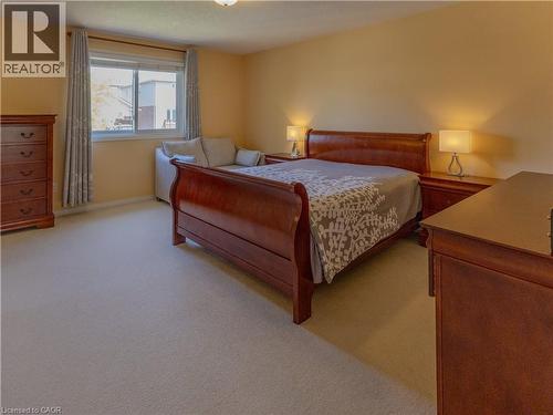 Carpeted room with a double-pane window - 212 Sleaford Street, Waterloo, ON 