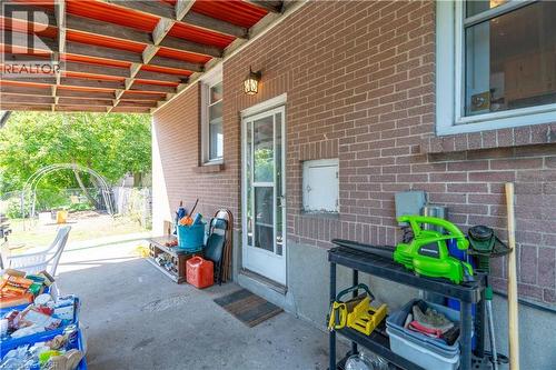 Back covered porch/ rear & lower level entrance - 1519 Howland Avenue, London, ON 