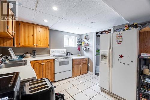lower level kitchen w/ view to laundry room - 1519 Howland Avenue, London, ON 