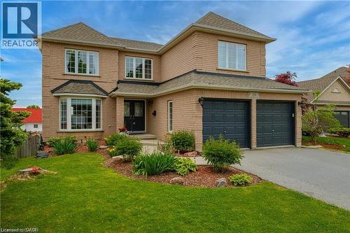 Two-story brick residence with an attached two-car garage - 26 Shadyridge Place, Kitchener, ON 