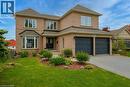 Two-story brick residence with an attached two-car garage - 26 Shadyridge Place, Kitchener, ON 