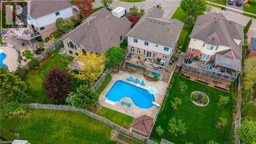 Expansive property featuring a large backyard with a fenced perimeter and mature trees - 26 Shadyridge Place, Kitchener, ON 