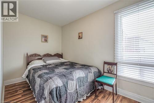 Warm-toned walls complement the wood-finish flooring - 41 Springhurst Avenue, Toronto, ON 