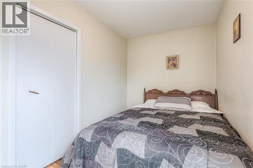 Bedroom featuring light-colored walls and wood-finish flooring - 41 Springhurst Avenue, Toronto, ON 