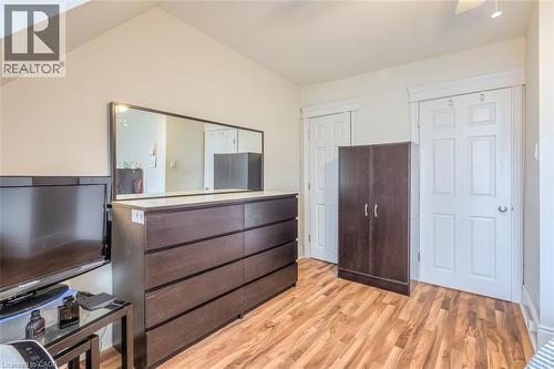 Room with vaulted ceiling, wood-finish flooring, and white trim - 41 Springhurst Avenue, Toronto, ON 