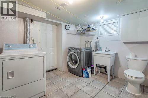 Dedicated laundry area featuring tile flooring - 41 Springhurst Avenue, Toronto, ON 