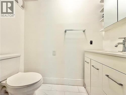 White vanity with a polished chrome faucet and coordinating hardware - 3135 Palmer Drive, Burlington, ON 