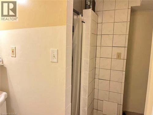 Tiled shower enclosure with white ceramic tile - 110 Peppler Street, Waterloo, ON 