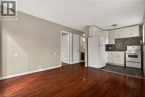 Back apartment: living room/ kitchen combined - 148 Huxley Avenue S, Hamilton, ON 