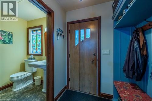 Main Floor powder room and side door to the covered side porch - 72 Crescent Boulevard, Simcoe, ON - Indoor Photo Showing Bathroom