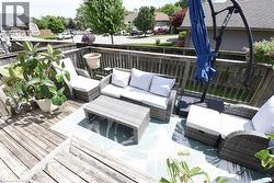 Outdoor wood deck with slatted wood railing - 