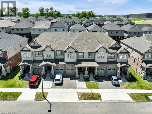 Stone and siding facade featuring multiple gables and a neutral color palette - 76 Grassbourne Avenue, Kitchener, ON 
