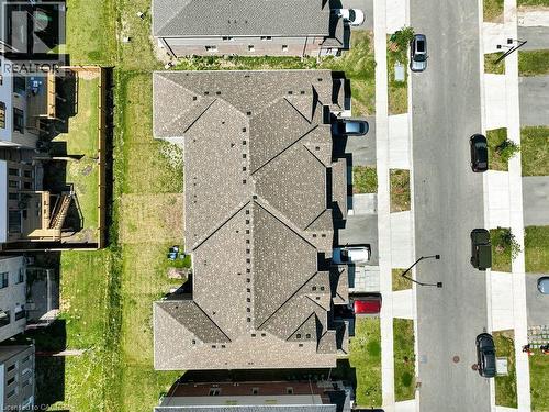New construction residential row with asphalt shingle roofing - 76 Grassbourne Avenue, Kitchener, ON 