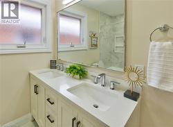 Dual-sink vanity with a white countertop and chrome fixtures - 