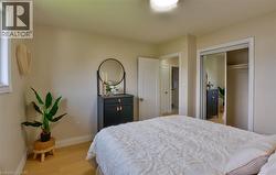 Light wood-finish flooring complements neutral wall tones - 