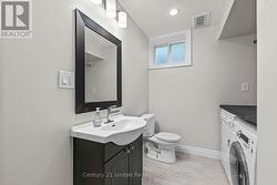 Unit 2 - Lower Level Bathroom & Laundry - 