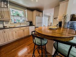 kitchen with door to double car garage attached - 