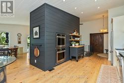 Rich wide-plank pine flooring throughout - 