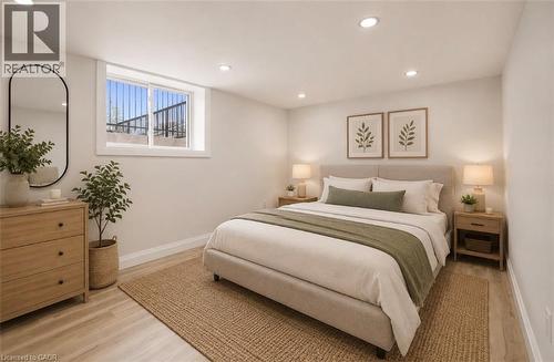 Bedroom featuring light wood-finish flooring and recessed ceiling lighting - 129 St George Street, Kitchener, ON 