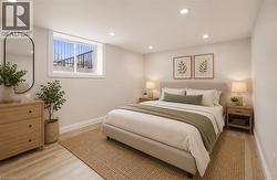 Bedroom featuring light wood-finish flooring and recessed ceiling lighting - 