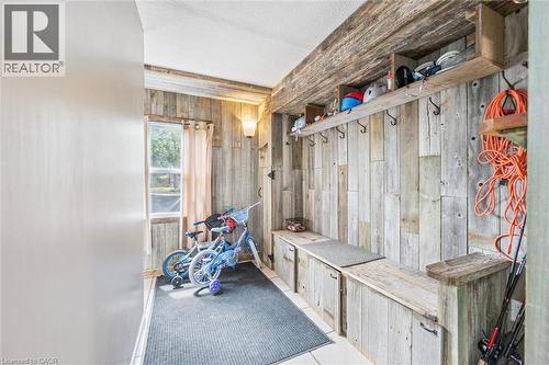 Entryway mudroom featuring distressed wood paneling - 24 Byton Lane, Cambridge, ON 