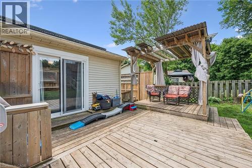 Expansive wood-finish decking with a dedicated shaded pergola area - 24 Byton Lane, Cambridge, ON 