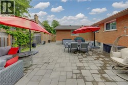 Expansive paver patio offering significant outdoor living space - 