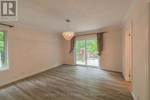 Primary bedroom with walk out to deck - 7463 Davy Drive, Ramara, ON 