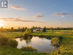 Sunset aerial with private pond and acreage - 