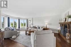 Open-concept living room with big windows - 