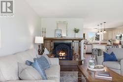 Fireplace sitting area beside kitchen - 
