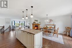 Dining room with fireplace and kitchen view - 