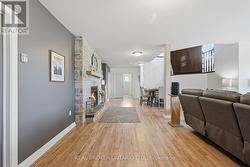 Basement rec room with stone fireplace - 