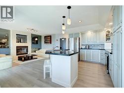 Kitchen to family room with gas fireplace - 