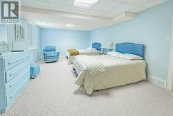 Interior room featuring light neutral wall paint and light-toned carpet flooring - 