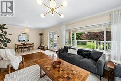 Living room with view out to front porch - 