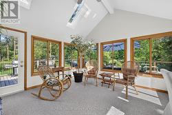 Sunroom walks out to deck and backyard - 