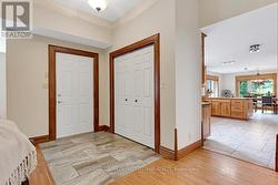 Foyer ceramic floor, oak trim & double closet - 