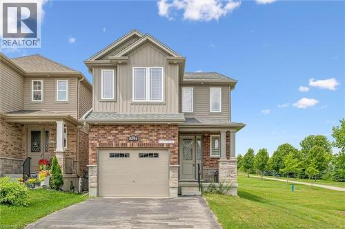 Modern two-story residence featuring a brick and siding exterior with stone accents - 153 Rivertrail Avenue, Kitchener, ON - Outdoor With Facade