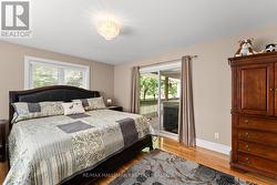 Master with walkout to covered deck and hot tub - 