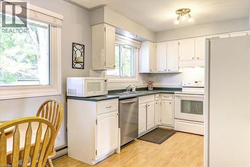 Functional kitchen with dinette area. - 12 Miller Crescent, Simcoe, ON 
