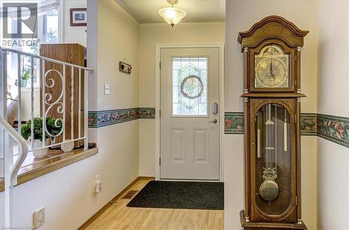 Foyer with large closet and inside access to the garage - 12 Miller Crescent, Simcoe, ON 