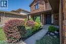 Brick exterior featuring a covered front entry with a dark-paneled door - 141 Lynndale Road, Simcoe, ON 